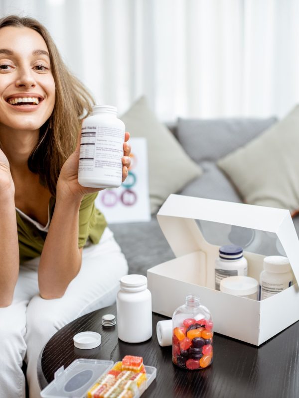 woman-with-nutritional-supplements-at-home.jpg
