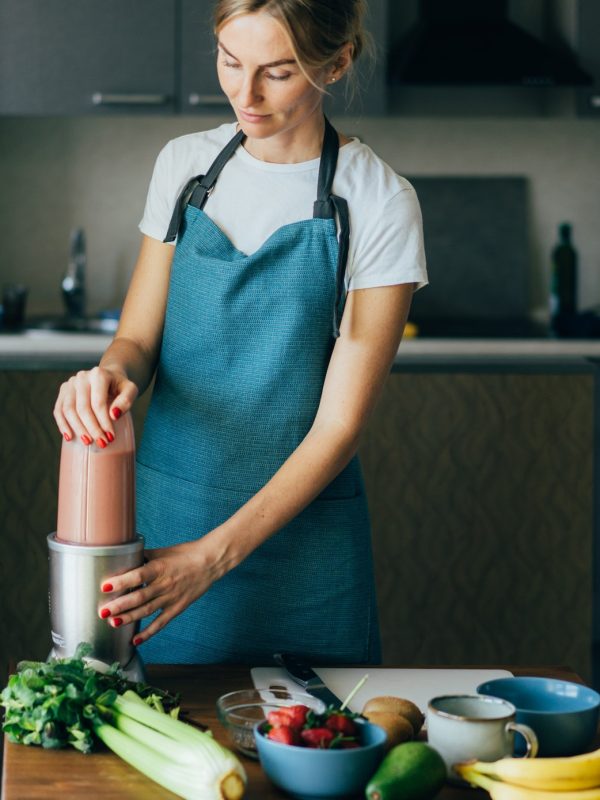 young-wellness-woman-preparing-a-nutritious-healthy-breakfast-in-her-kitchen-.jpg